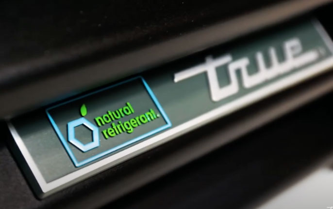 Learn about True® Refrigeration and our Commitment to Sustainability - Natural Refrigerant Logo - Close-Up on Fridge